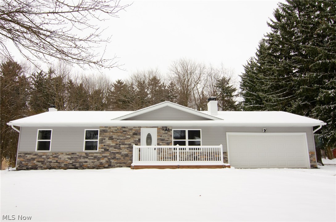100% transformed home! Roof, gutters, siding, windows, A/C, furnace, hot water heater, garage door & opener, doors and complete interior are all new! The cedar front porch has built in lighting and vinyl railing. Enter into the open floor plan with waterproof laminate flooring, recessed lighting and neutral color palate. Bright living room has a wood burning fireplace. The eat-in kitchen has a shiplap feature wall, gorgeous granite, hand blown glass pendant lights, glass back splash, farm house sink, stainless Samsung appliances, tons of beautiful soft close cabinets and sliders out to the back patio. The main bathroom has tile flooring, tile tub surround and a spectacular granite top vanity. All bedrooms are carpeted. The master bath also features tile flooring, tile walk in shower, storage nook and beautiful double vessel sink vanity. The finished basement has carpeting, recessed lighting, new stairs and another wood burning fireplace! Utility/laundry room provides plenty of