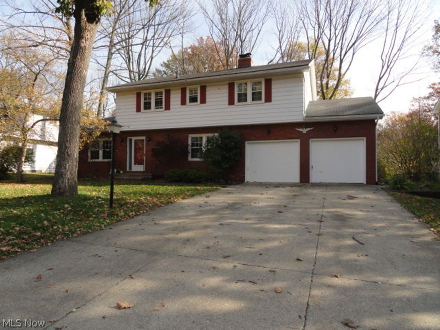 This 4 bedroom, 2.5 bath Colonial is in great condition. Step into the foyer entry with open staircase to the 2nd floor. Formal living room. The charming and updated eat-in kitchen has beautiful maple cabinets and  hardwood floors and it  opens to  the cozy den with woodburning  fireplace and a spacious dining area complete with breakfast bar. 4 generous sized  bedrooms and 3 nicely updated bathrooms too! Newer windows and AC, waterproofed basement and extra insulation installed.  Nice, large deck overlooks wonderful, big lot all in the desirable Oak Tree subdivision between Kent and Graham Rd. Very convenient to schools and Rt 8/Rt 77.