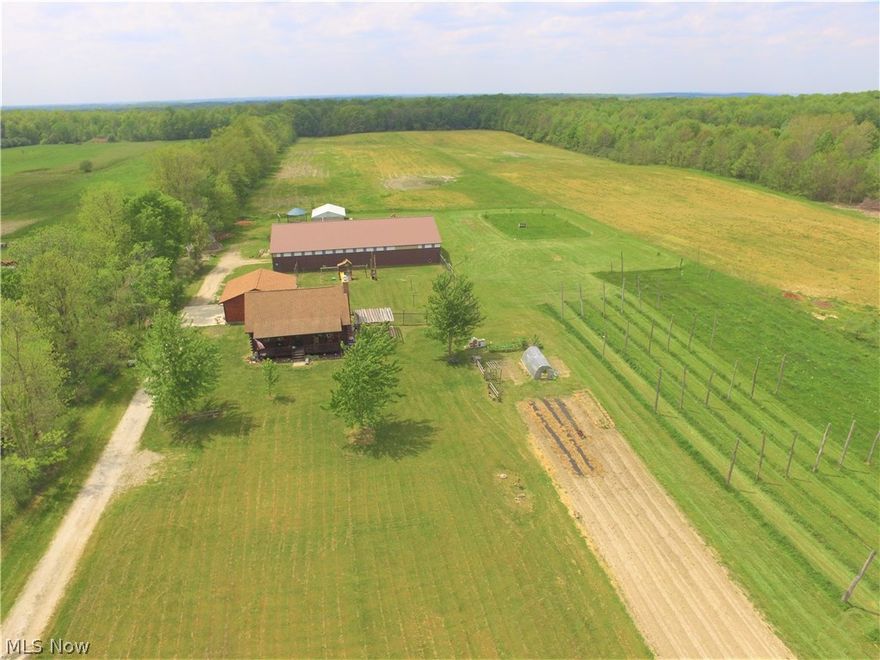 Horses, cows, chickens, orchard, crops…this gorgeous Kuhns Bros. log home on 15+ acres can be anything you want it to be with many updates and highlights to enjoy! Beautiful hardwood floors throughout and the kitchen has been redone with custom hardwood cabinets, custom under-mount sink, granite counters, GFIs, under cabinet lighting, wine racks, large island and breakfast bar, plus newer appliances(2012). Vaulted family room with plenty of space, fireplace, energy efficient lighting and outlets with USB charging stations. A half bath, large bedroom, and access to the back deck(2016) and attached 2.5 car garage(2015/2016) finish the first level. Upstairs is a spacious bedroom and full bath with a third bedroom/office on lower level. Bathroom updates include toilets, faucets, flooring and waterlines(2012). Others include new porch steps/apron, chimney cap, water softener(2012), Geothermal heating/cooling (2013), two new water heaters (2013), basement door, laundry appliances, and sealin