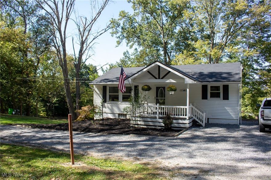 Charming and meticulously maintained 3-bedroom, 1½-bath home on .43 acres just outside the Coshocton city limits, offering a peaceful wooded setting and the perfect mix of country tranquility with convenient access to town. The property features a large outbuilding with a single garage bay and a workshop/storage area in the back, a chicken coop, and a cozy firepit area for outdoor gatherings. Recent roof shingles and numerous updates throughout provide modern comfort and peace of mind, and the interior shows exceptionally well — truly move-in ready. Ohio Basement Authority system installed basement system and excavation work has been completed to divert water drainage and provide better access to shed and parking. Contact me or your agent to schedule a private showing.