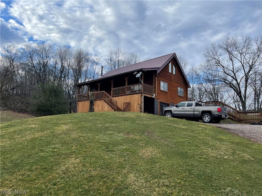 If are looking for privacy with convenience to SR 7 (1.5 miles) and US 33 (5.5 miles) You have found it here! This 3+ bed, 2 1/2 bath log home offers a Great room, dining area, kitchen, Bedroom and full bath (garden tub and separate shower) on main level. 2nd story offers a bedroom, half bath and lofted study area.  Lower level, walk out basement offers another tv/media room area, full bath, bedroom, office, storage and a laundry/utility room. Home has a two car detached garage. Rear deck, front porch. You can heat with a wood furnace, electric or propane! Home has central air, septic (aerator) Tuppers Plains water, and Windstream internet.