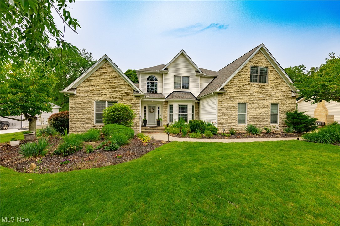 Nestled on a full 1-acre lot backing up to the Cuyahoga Valley National Park hike & bike trail, this spacious home offers the perfect blend of comfort, functionality, and outdoor living. Step into a dramatic two-story foyer that opens to a soaring two-story great room with gorgeous stone (gas) fireplace—perfect for gatherings. The open-concept eat-in kitchen features maple cabinetry, Corian countertops, center island, and new frig & dishwasher. Natural light floods the adjacent family room with wet bar & sliders to the backyard. The formal dining room sets the stage for entertaining, while a first-floor office offers flexibility as a potential 5th bedroom. The first-floor owner’s suite is a private haven featuring a jetted tub, skylight, separate shower, and walk-in closet. A powder room & laundry room complete the 1st floor. Upstairs, you’ll find three generously sized bedrooms which share a full bath, ideal for family or guests. The full basement includes Everstone flooring, and is plumbed for a full bathroom. There is a large crawl space to provide tons of storage, allowing for the rest of the basement to be finished for additional living space. (YES! The pool table stays) As if the 3-car garage with epoxy flooring isn't enough...There is also a large outbuilding, perfect for hobbies, additional storage, or extra garage space. But the best if yet to come... Step outside to the expansive fenced-in backyard featuring a massive deck/patio for entertaining, cozy firepit to make smores, or take a relaxing dip in the crystal clear 18x33 pool! Updates include Roof & Gutter Guards (2019), A/C (2017), Hot Water Tank (2014), Pool Liner (2022), & fence. Stair lifts from main floor to 2nd floor and to basement may be removed if Buyer wants. Don’t miss your chance to own this rare combination of space, privacy, and access to nature—all just minutes from local amenities!