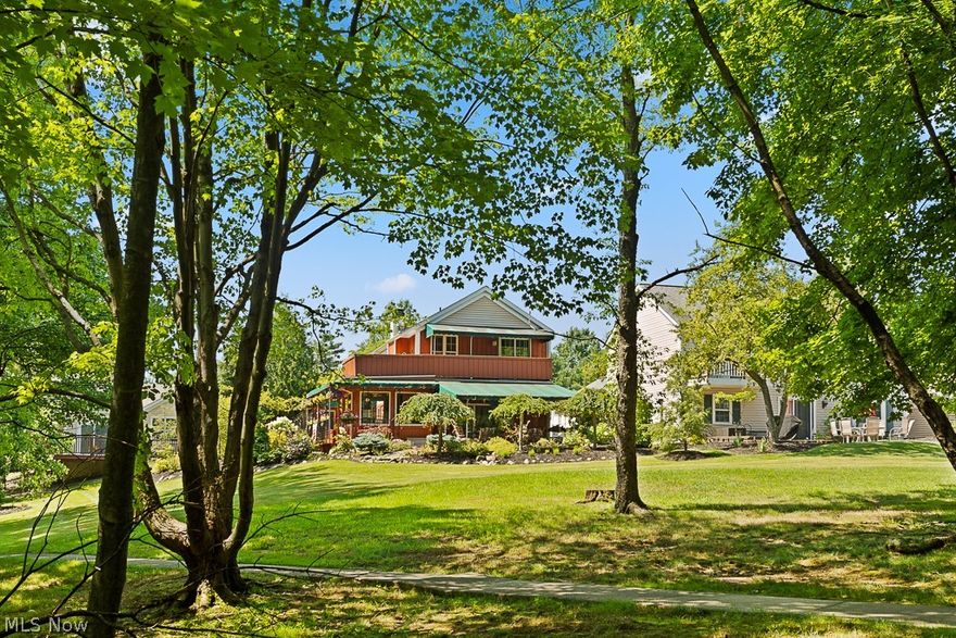 Newly listed Cape Cod-styled colonial cluster home in High Point! Set on a private cul-de-sac lot abutting the wooded common area on 2 sides with a breathtaking Lake view and extreme outdoor living and entertainment! Totally remodeled and adorned with rich woodwork details & hardwood floors! An elegant entry leads to a stately great room with a fireplace and pass-thru bar and a magnificent skylit French Provincial-style gourmet eat-in kitchen with loads of details, upgraded appliances including a Viking range vented to outside - additional ovens - refrigerator - Granite tops, instant hot and access to a large deck with newer wood floor! Outdoor fun and entertainment offer a paver patio with an awning, an enclosed privacy room with cedar walls and a cozy stone fireplace, and an outdoor heated kitchen with a sink and bar! Upstairs you'll find an awesome executive master suite with fireplace, built-in breakfronts & dresser, double closets, a luxurious bath with heated floor and access to the balcony with sink and awning, a second full bath with jetted tub, plus 2 additional bedrooms! The attached heated garage has lots of built-in storage, overhead lighting, 2nd refrigerator, and complete with a pet wash!  Professional landscape with auto sprinkler and lighting. a whole house attic fan! Newer driveway and walks, ring doorbell system, and microwave! High Point amenities abound with a swimming pool, walking trails, community clubhouse, and tennis courts for its residents!