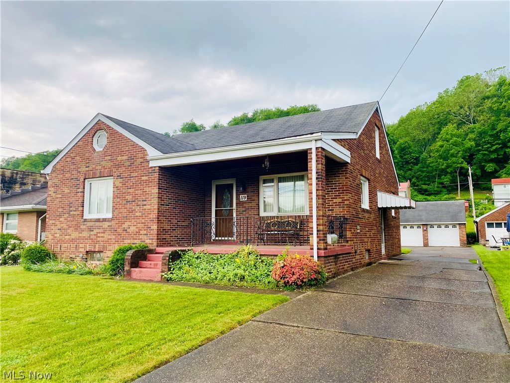 BEAUTIFUL BRICK HOME in Rayland on the brick-paved section of Main Street! This 3 bedroom home has been meticulously maintained and is move-in ready! This home boasts beautiful woodwork including the doors and floors, a bonus room in the finished attic, a two car garage, and a flat yard! Additionally, you will find bathroom facilities in the basement as well as a workshop, and a chairlift. Sit on your porch and enjoy the peaceful neighborhood, or amble over to the nearby Fairway Links Golf Course (the old Mazeroski's) for 9-18 holes or a yummy snack! Sellers have recently waterproofed the basement with Ohio Basement Systems; warranty is transferrable to buyers. Schedule a private showing today!