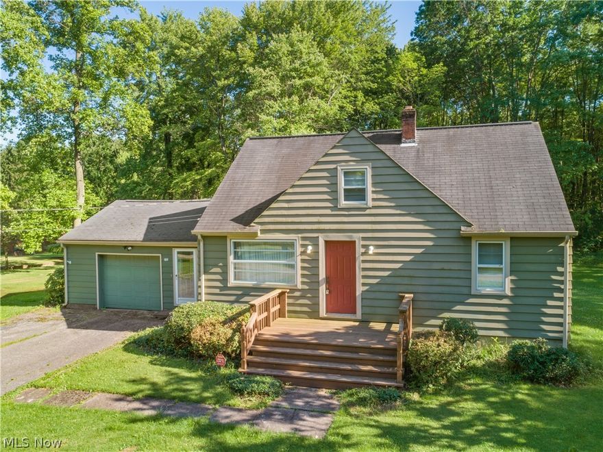 This charming bungalow sits on a large, park-like lot just outside of Newton Falls city. Close enough to walk into town and enjoy the benefits of restaurants, grocery stores, drugstores, library, waterfall, and more - plus city water and sewer - but still far enough out to have a quiet road and beautiful yard. Walk through the front door from a large, welcoming porch into your living room with a charming built-in bookcase and decorative ceiling texture. First floor features hardwoods in bedrooms, new carpet, bathroom, and eat-in kitchen. Off the kitchen is a large sunroom that showcases the gorgeous outdoor space. Spacious one car garage with enough room for vehicle plus storage. Upstairs, there is a large loft featuring hardwoods and new carpet with a third bedroom, office or children’s playroom. Current owners have done upgrades includes lot grading, new carpet and paint, and a new radon system. Move right in and enjoy your new home!