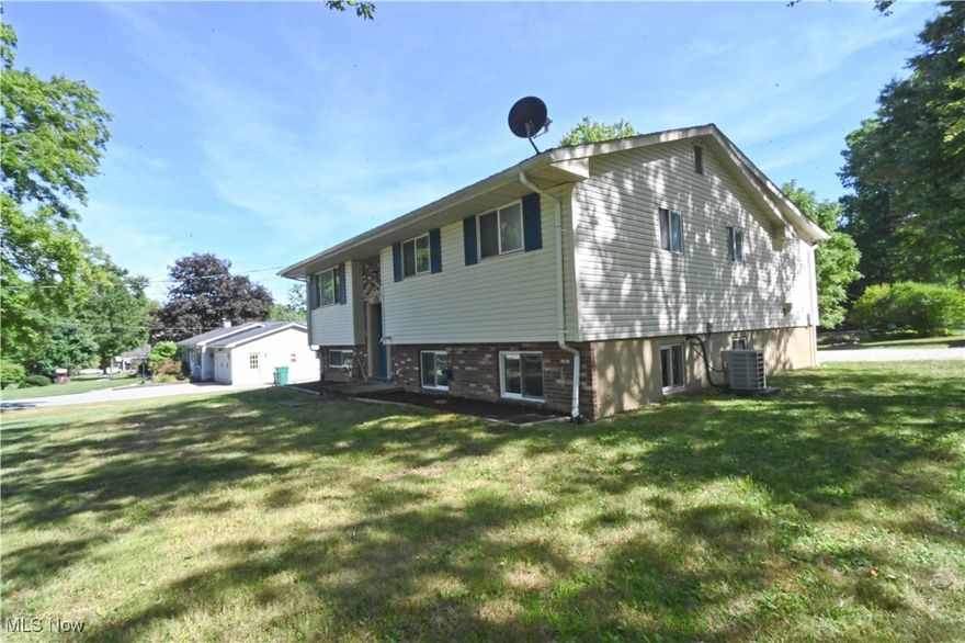 Amazing space in this 5 bedroom 3 full bath Bi Level Home. REMODELED! Situated on a corner lot on almost half an acre of property. There is so much closet and storage space here! Updated within the last 4 years:vinyl siding, gutters, downspouts, and septic system. (Seller ordered the Point of Sale inspection with Trumbull County and is awaiting the scheduling. Previous owner also added new drainage done around foundation of home. Oversized REMODELED 2 car garage, new concrete floor 2022, updated garage door, electric panel, updated drains &plumbing.  Primary suite with walk in closet, full private bath with walk in shower! Appliances are newer as well in the updated kitchen with a double oven & granite countertops! The upper level of the home consists of Living room, dining, kitchen and sunny breakfast room along with three beds and two full baths. The lower level offers an enormous family room, 2 more bedrooms and a full bath plus laundry and utility area and a walk out to the backyard. 2 sump pumps in the lower level of the home. Water softener. AC and Furnace are 4 years old. Walk out lower level.Deck right off of the Kitchen. Looking for a little bit of country, check out this great find! CALL TODAY!