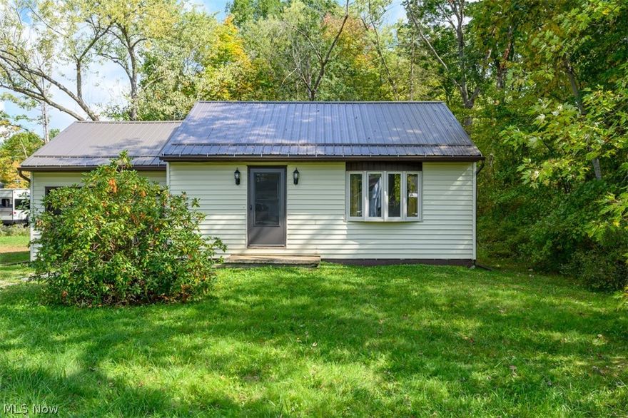 Welcome home to this beautifully renovated 2 bedroom ranch near Lake Milton.  From the new metal roof and gutters to the tastefully done kitchen and bath this home is perfect for the weekend get-a-way to the lake or for someone looking to downsize and not have to do any work once they move in.  The property includes multiple parcels totalling nearly a half acre so ther is room to spread out and have a nice yard.