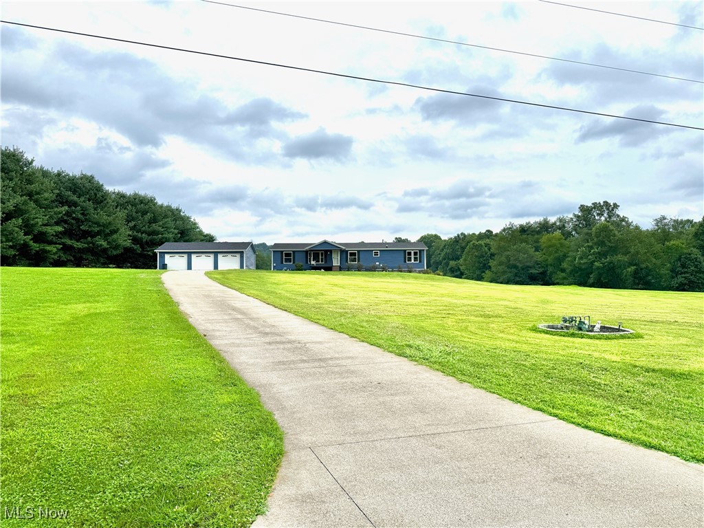 Location, Land, and Layout – This One Has It All.
Set on 6.79 clear, rolling acres in the Warren School District, this updated home offers the kind of space—both indoors and out—that's hard to find and easy to love.
Step inside to a modern, open-flowing layout designed for real life. The updated kitchen and primary ensuite both feature stylish tile work and thoughtful finishes that blend function with comfort. With three full bathrooms (yes, three!), there's room for everyone to spread out and never wait in line.
The multi-purpose full basement adds even more flexibility with its own big bathroom, kitchenette, and walk-out access to a private , stamped concrete, patio—ideal for guests, hobbies, or an in-law suite setup.
Car lovers, hobbyists, or anyone needing extra storage will appreciate the three-stall garage, offering plenty of space for vehicles, tools, or your next big project.
Outside, a rear deck overlooks peaceful acreage, perfect for morning coffee or evening unwinding. A long concrete driveway adds curb appeal and plenty of parking, all just minutes from OH-7 and SR-550—making commuting or running into town quick and convenient.
Updated. Spacious. Ready to grow with you.
Want to see it in person? This one is worth the walk-about—schedule your showing today!