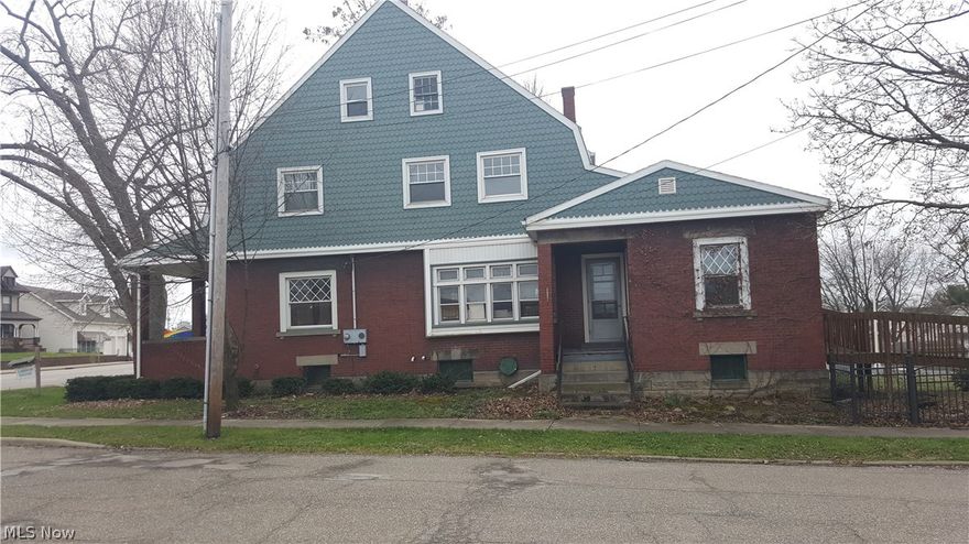 3 bdrm, 1 1/2 baths, with so much potential. Plenty of rooms to make this a 4, 5, or even a 6 bedroom home! Generous 15x27 living room with fireplace & beautiful, original pocket French doors, spacious 15x17 dining, 1st floor office area or bdrm with private entrance, double staircases leading to 2nd floor. The architectural roof shingles, brick and vinyl half-round shingle siding adds a distinctive touch to this century home!  Situated on a convenient corner lot. Call quickly for more details on this one! 
Other updates include furnace, C/A, kitchen cabinets, windows, electrical, laminate wood flooring thru-out and carpet in upper bedrooms. The home also offers a 2nd kitchen on the 2nd floor with newer cabinets (can be converted to a bedroom), very large attic can be re-finished again to add more bedroom space. 4 entries including handicap/wheel chair entrance and enclosed back porch, front enclosed foyer/entry, side entrance into small foyer leading to offices or bdrms, and other si