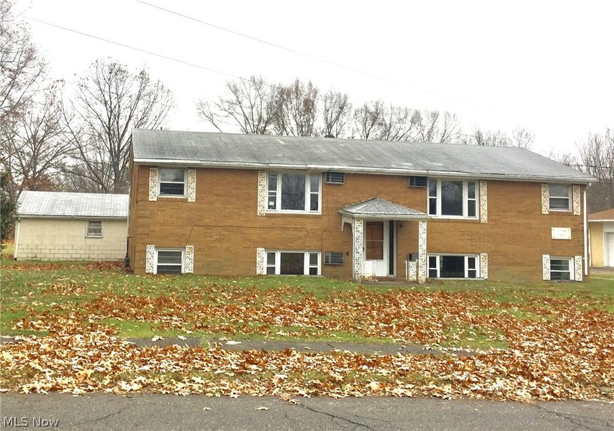 4 Plex on large lot. Property sold "As Is". Everything needs redone. CASH buyers, 2 Bdrms 1 bath each unit laundry areas. Mineral rights pass to buyers.