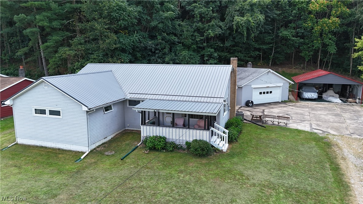 Welcome to 46711 Township Road 74! This home is conveniently located just a few minutes away from Roscoe Village and downtown Coshocton. This miraculous Ranch home is situated on just over 2 acres and provides plenty of peace and quiet within a fantastic neighborhood. It offers 4 bedrooms, 1.5 bathrooms, a screened in front porch, 2 car detached garage (24' x 24') with 220 electric, and an additional enclosed carport (24' x 25'). As you enter, you'll immediately notice the timeless, original hardwood flooring throughout the home that leads in to spacious bedrooms and a stunning bathroom, which recently had $15,000 in upgrades. One of the many perks of this home is that the master bedroom has the convivence of a 1/2 bath. The B dry basement has a blank canvas waiting to be finished to your desire. The metal roof was installed in 2017. In June of 2025, a new breaker box and a new 50 gallon hot water tank were installed. The range and refrigerator will convey to the new owners. If this isn't enough to catch your attention, the sellers are offering a $5,000 carpet allowance to be paid to the buyers at closing! What are you waiting for? The only thing missing is you! Call today to schedule your showing!