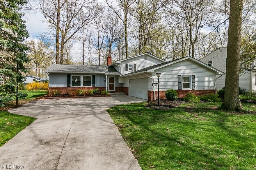 This well loved home features 3 bedrooms, 2 full baths, a Living Room, Dining Room, Family Room Plus a Den (has garage entrance) and an Unfinished Basement.  Enjoy a lovely visit on the updated paver patio (2017) with firepit and a natural gas grill.  Upstairs Full Bath updated 2019, Laminate flooring in Kitchen and carpet 2011, Kitchen cabinets 2011, Bar Counters, Recessed lighting and 1/2 kitchen updated 2019, Kitchen Window and Skylight replaced 2020, Wood Burning Fireplace in lower level family room,  Kitchen, Baths and Master painted 2021, Office Carpet 2005.  Vinyl Windows.   Roof was replaced 2014.    Front Door replaced 2014, Patio Door replaced 2017, Hard wood floors in the Living Room, Dining Room, upstairs hall, steps and bedrooms (carpet replaced in Living Room, Dining Room, Steps and Hall 2011).  Family Room wired for surround sound.