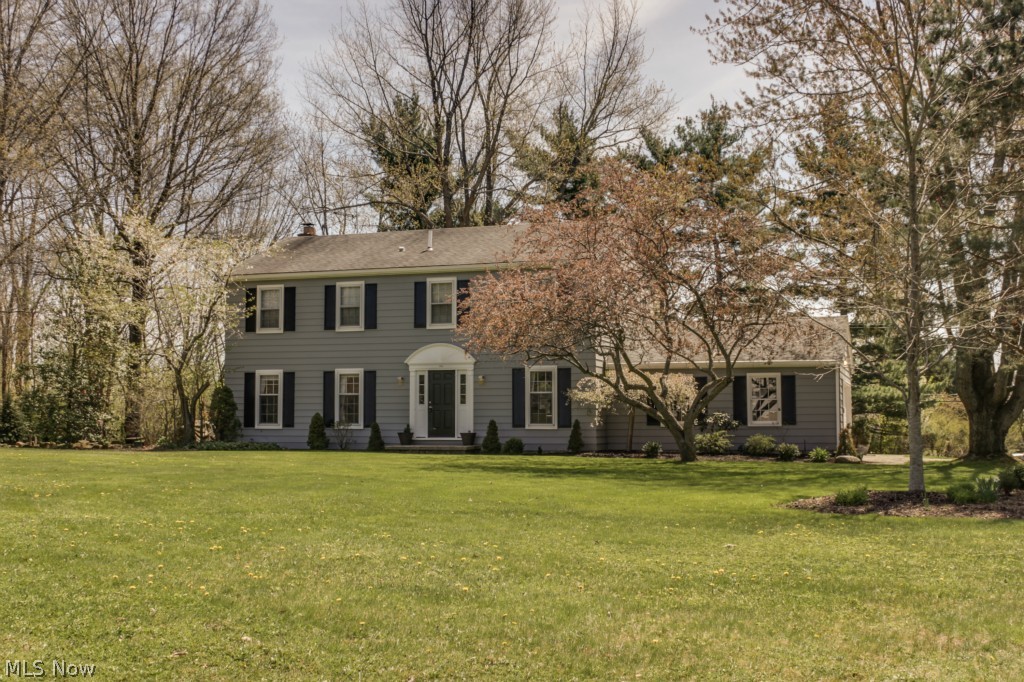 This coveted 4 bedroom 2 1/2 bath Colonial in N. Hudson is on a spacious corner homesite with a side entry 2 car garage. The backyard is a charming retreat with an outdoor fireplace, and a stunning brick patio that has a radiant heating option! When you walk through the Front Door there is a large living room and the dining room has been redesigned to open into the kitchen. The wooden beams in the dining/kitchen were harvested from trees in Akron. The granite was custom cut for the bar ledge in the kitchen when it was remodeled in 2006 with maple cabinets. The Family Room leads you to a 3 seasons room off the back of the home to enjoy the private landscaping. The basement has a finished area perfect for watching your favorite sporting events! The Master Bedroom boasts a spacious bathroom with two separate sinks, a large jetted soaking tub, and a tiled shower (2011). The laundry room was relocated to the upstairs but the hookups are still an option in the mudroom and the basement. Updat