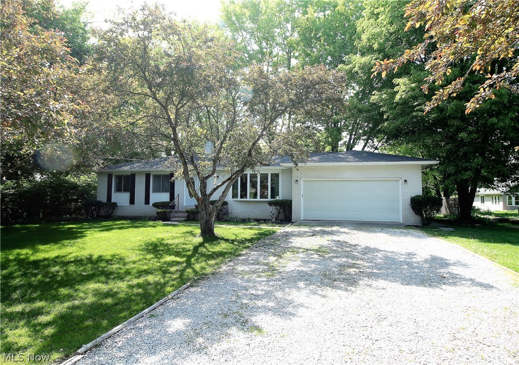 Welcome to this stunning four bedroom, two full and one half bath ranch home. Come on into this bright living room offering a large bay window to let the natural light to shine through. This home has new luxury vinyl plank flooring (2021), new lighting throughout and the walls and ceilings have been freshly painted. The dining room has a slider door that leads out to the gorgeous recently stained (2021) deck overlooking the tranquil large backyard. The charming, bright, inviting kitchen offers abundant of cabinets, granite counters, built in microwave, stove, refrigerator. There are three bedrooms with all new carpeting (2021) and a full bathroom with new flooring. The master suite offers a half bath which has been completely redone. Lower level is totally finished offering new carpet, freshly painted, fourth bedroom with new carpet (2021), full bathroom has new vanity top and toilet, bar, stone fireplace, tons of storage and a new slider door leading to the backyard. WOW! The backyard