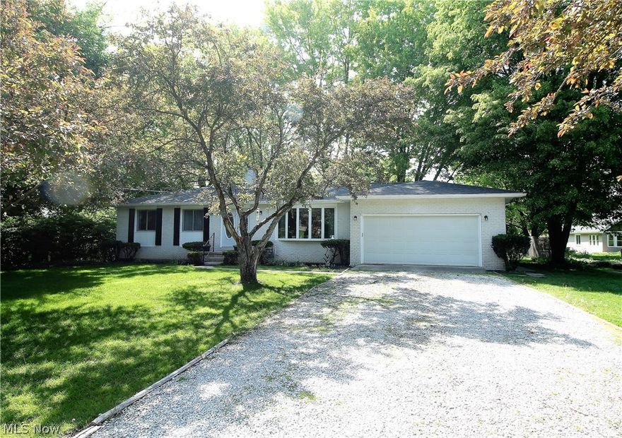 Welcome to this stunning four bedroom, two full and one half bath ranch home. Come on into this bright living room offering a large bay window to let the natural light to shine through. This home has new luxury vinyl plank flooring (2021), new lighting throughout and the walls and ceilings have been freshly painted. The dining room has a slider door that leads out to the gorgeous recently stained (2021) deck overlooking the tranquil large backyard. The charming, bright, inviting kitchen offers abundant of cabinets, granite counters, built in microwave, stove, refrigerator. There are three bedrooms with all new carpeting (2021) and a full bathroom with new flooring. The master suite offers a half bath which has been completely redone. Lower level is totally finished offering new carpet, freshly painted, fourth bedroom with new carpet (2021), full bathroom has new vanity top and toilet, bar, stone fireplace, tons of storage and a new slider door leading to the backyard. WOW! The backyard