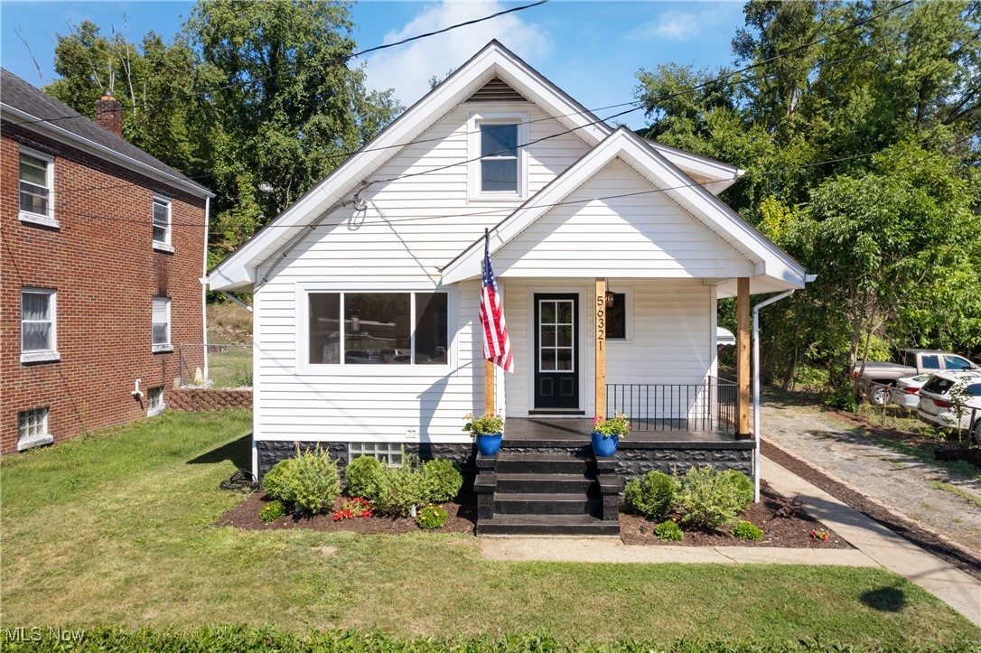 Welcome to 56321 Riley Rd, a beautifully remodeled 4-bedroom, 2-bathroom home in Brookside, where classic charm meets modern upgrades. Every detail of this home has been thoughtfully designed to offer a comfortable and stylish living experience. The main floor features two bedrooms with refinished hardwood floors adding warmth to the home and new light fixtures throughout, creating a bright and modern feel. The kitchen is a highlight, boasting brand-new shaker cabinets, modern hardware, a sleek tile backsplash, and durable tile flooring—perfect for anyone who loves to cook and entertain. Both bathrooms have been fully updated with new vanities, fixtures, and flooring. Upstairs, you’ll find two additional bedrooms with new carpet creating a cozy space to relax. The home also has updated electrical, pex plumbing and new windows throughout, ensuring your peace of mind for years to come. A standout feature of this property is the accessory dwelling unit, offering an additional 1,008 sqft of living space, including two bedrooms, one bathroom, a garage space, plenty of basement storage, updated electrical and a brand new roof. This unit is perfect for independent family members or as a rental income opportunity! Ask your realtor for the full list of updates! Located in a peaceful neighborhood, yet close to all the amenities Bridgeport offers, this home is a perfect blend of comfort, style, and convenience. Schedule your private showing today and discover the exceptional lifestyle awaiting you at 56321 Riley Rd!