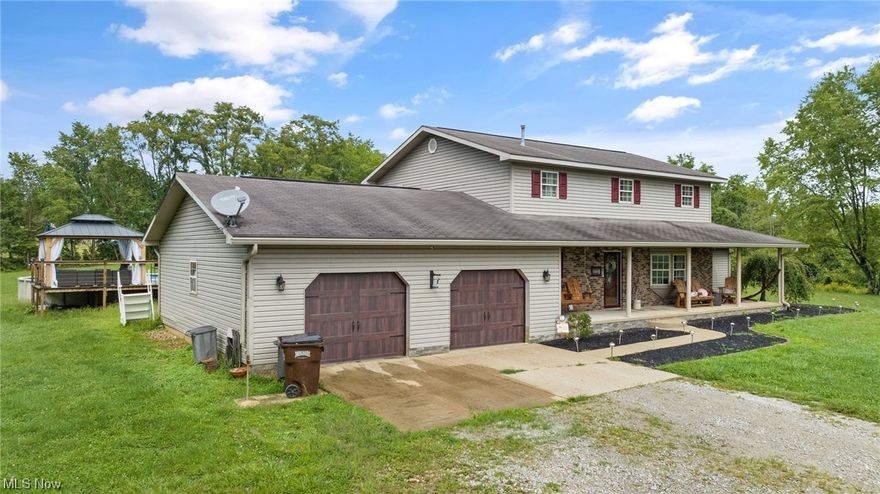 Enjoy the peace and privacy of this two story home with an inviting front porch with tree lined views and situated on 3.5 acres.  Very well maintained with updates including first floor bath, new free standing soaking tub in upstairs bath, painting throughout and above ground pool with deck area. Offers 4 bedrooms and 2 full baths. Oversized 2 car garage. This is truly a tranquil setting and one of a kind find.