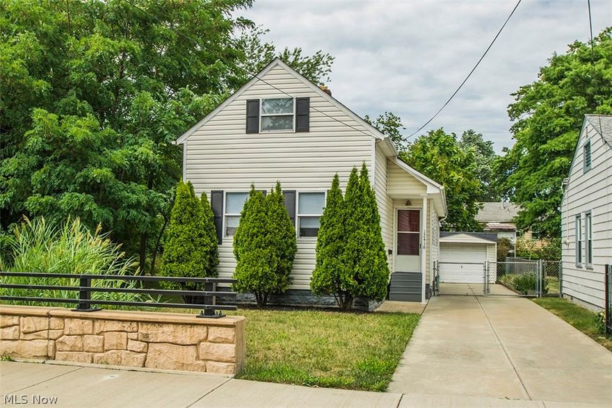 Move right into this outstanding like new Victorian look bungalow!  The crisp clean interior features gleaming laminate flooring throughout! Updated eat in kitchen with new tile back splash includes full appliance package! Spacious great room joins roomy first floor master! Updated full bath conveniently opens to master bedroom and hallway! Upstairs you will discover 2 sizable bedrooms with roomy closets and convenient half bath! The basement with glass block windows offers ample storage with washer and dryer included. Manageable fenced yard includes patio and 1.5 car garage!  Home warranty provided!  Don't miss this one!!