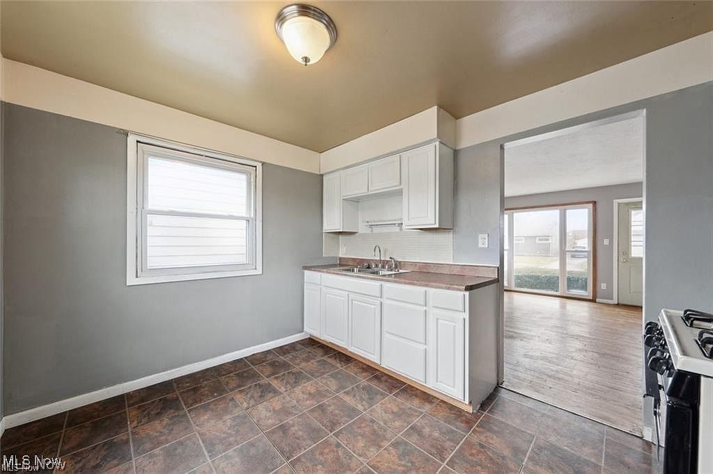 Photo of 12214 Woodward Boulevard, Garfield Heights, OH 44125 (MLS # 5195898)