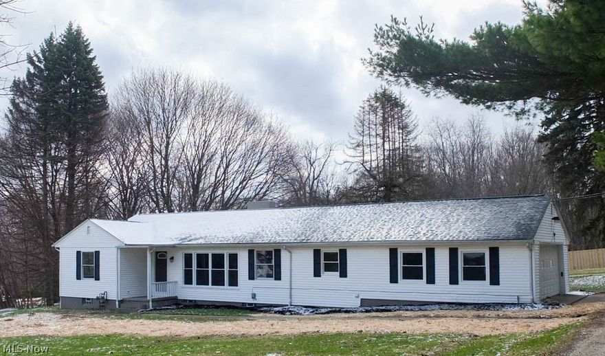 Wow! You will love this wonderfully remodeled 3 bedroom, 3 full bath home with updates throughout! New flooring, fresh paint, remodeled bathrooms, updated kitchen...PLUS it's on 1.6 acres! The spacious living room/dining room has wood flooring and is open to the kitchen. The beautiful kitchen has stainless steel appliances, tile backsplash, hardwood flooring, granite countertops and a breakfast bar. The main bath has been completely redone with a walk-in shower and updated vanity. First floor laundry too! The sun-filled master suite has two closets and a private full bath with tile shower surround and an updated vanity. The two additional bedrooms are generously sized with new carpet. On the lower level, there's a finished rec room, a full bath with a new vanity and tile shower surround, a bonus room that could be used as a fourth bedroom and amazing storage space! 2-car side load garage with a new garage door opener. Updates include a new roof, newer septic system, new interior doors,