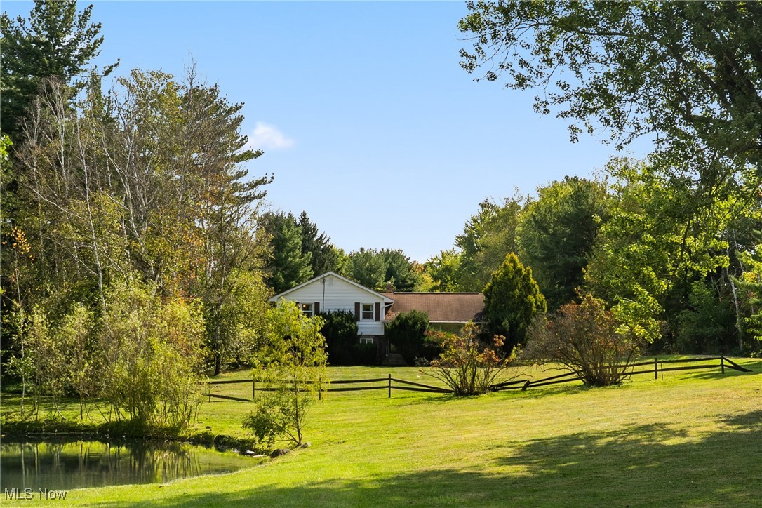 Discover this updated 3-bedroom home on nearly 5 acres, just minutes from Blossom Music Center, Portage Crossing, and Route 8! The kitchen shines with quality finishes, while the living room overlooks birch trees and a front-yard pond. Upstairs you’ll find 3 spacious bedrooms with large closets and a beautifully finished full bath. The lower level offers storage plus a bonus room for a 4th bedroom, office, or theater and a half bathroom! Step outside and experience your own private park—complete with open green space, mature trees, and a stunning natural pond at the far end of the property. Extra outbuildings provide endless opportunities for hobbies, cars, gardening, or pets. This property has been cherished by the same family for years, and now it’s ready for its next chapter. Don’t miss the chance to own your own slice of paradise—schedule your private tour today!