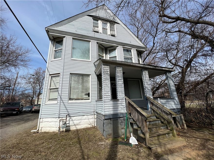 Large colonial on great street near Downtown and University Circle.  House needs updating and is being sold as is.  Newer roof and good siding.  Property is completely fenced in and features an enormous commercial style garage that can fit up to 6 cars.  Great oppotunity for owner occupant or possible rental or group home.