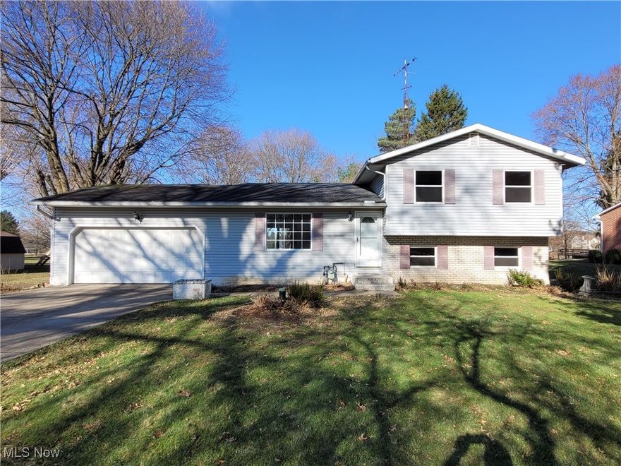 Looking for the right combination of home features at the right price, close to everywhere, but yet not too close? This split-level home situated on 1 acre is freshly painted inside with new carpeting & vinyl plank flooring where it was needed. A new hot water tank was also recently installed. Low maintenance vinyl replacement windows throughout for energy efficiency. Imagine yourself enjoying the fresh air in the large rear yard this spring, summer and fall. This home is waiting for the right buyers to snatch it up and finish the updating with their own personal touch.