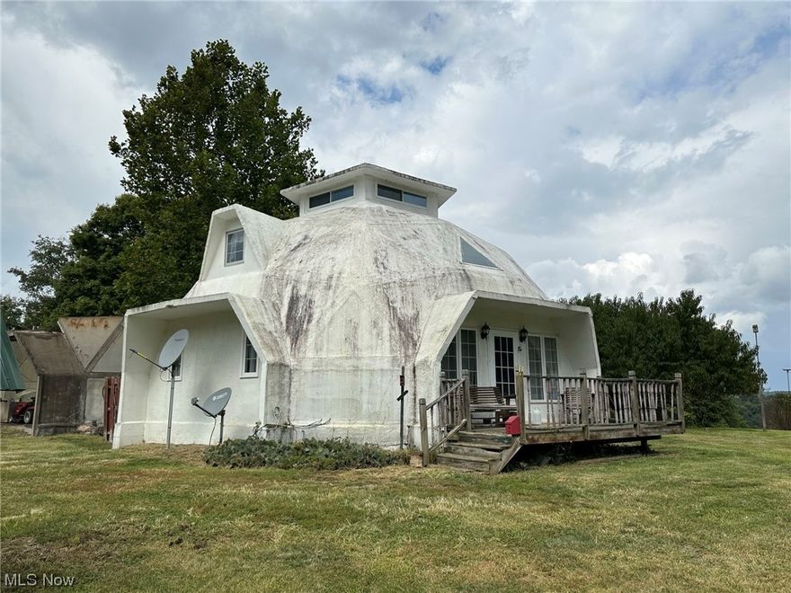 Offering a home on 8.37 acres, a beautiful setting in beautiful Guernsey County. If you want seclusion and a beautiful scene this is it. This is an octagon, dome shaped home, it is unfinished and will need some work. There is only a sub-floor.  This is an estate and sells as/is. A home and mini sheds on 8.37 acres. There are 3 water wells on the property. Located just minutes from Interstates 77 and 70 and Cambridge, OH. Oil and gas mineral rights do NOT transfer.