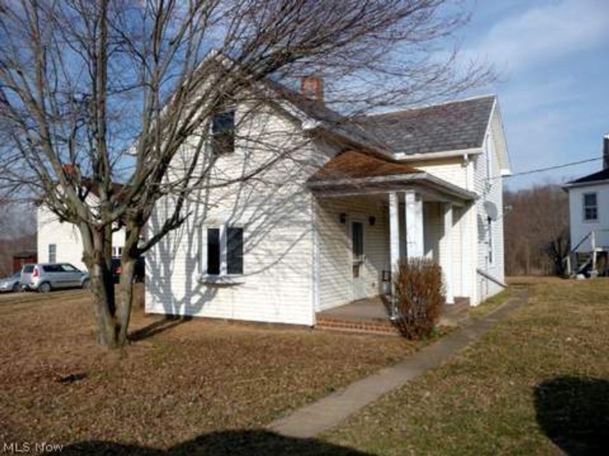 Small town living in this great starter home with 3-4 br. one bath, spacious sunlit living room, formal dining room, first floor laundry, new flooring in the kitchen, and hardwood floors on the main floors.  There's covered front and back porches with large level yard, 2 car detached garage, full basement for added storage and home is ready for occupancy.  A great place to fix up and call your own, and your payment is cheaper than renting.  The garage has a newer roof, some rooms have been freshly painted and home has county water.  Call today for appt.