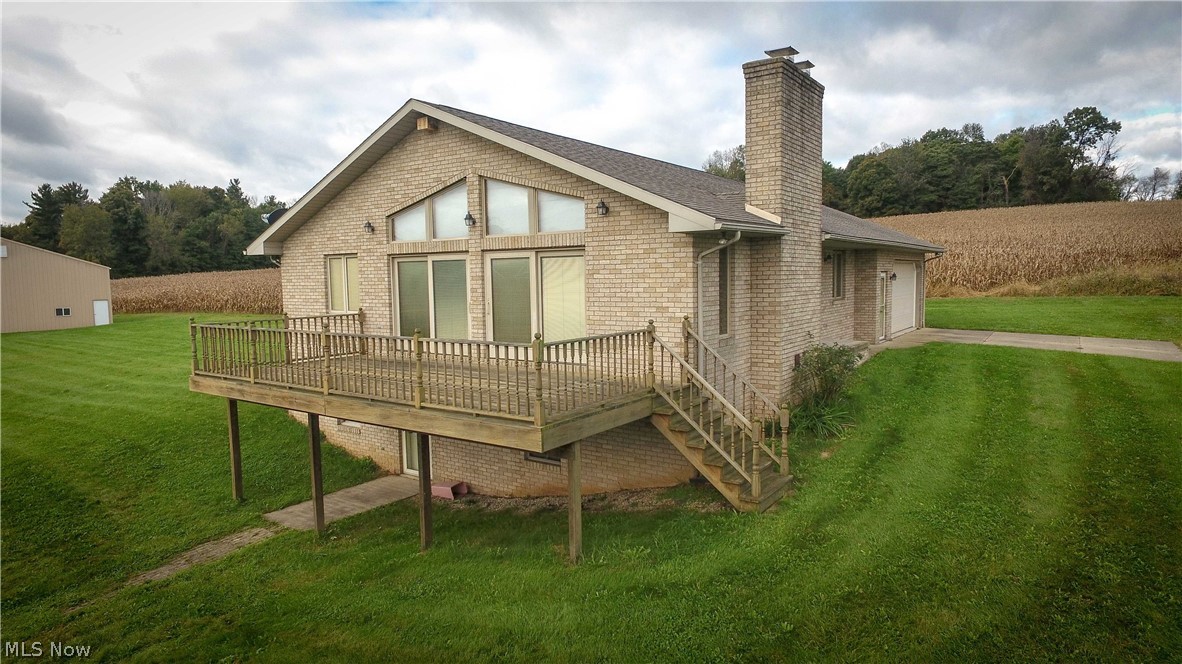 Quality brick ranch home on 28.5 acres overlooking a two acre pond located in western Wayne County. This quality built home has a cathedral ceiling and stone fireplace in the great room. A wall of windows looks out over the stocked pond. A large master bedroom with a nice master bath, two additional bedrooms all on the first floor. A attached garage and first floor laundry finishes the main floor. A walk out basement with a family room with fireplace, full bath and large unfinished area. The property has a 60x40 heated pole barn with 220V. The land itself features woods, tillable acreage and pond. This property has it all, come take a look.