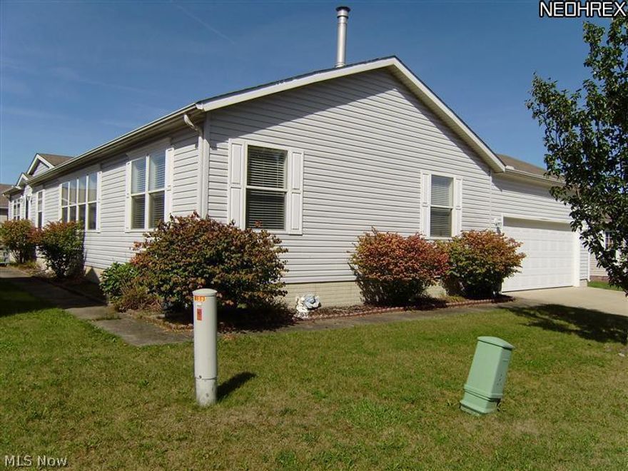 Just Waiting for You! Wonderful modern ranch manufactured home built in 2002, with 3 bedroom and 2 full baths located in desirable Lakeside Terrace. Open floor plan, spacious vaulted kitchen w/ long island and breakfast bar, skylights, pantry, lots of cupboards open & airy with eating area. All appliances stay including washer & dryer. Formal Living Room with vaulted ceiling & French doors that open to deck. Formal dining room. Family room with gas fireplace, perfect for those cold nights. Master bedroom has huge walk in closet. Master bath has double vanity and extra cupboards, linen closet, soaking tub, separate shower and sky light. First floor laundry. Carpet 2010.  Attached 2 car garage. Huge basement waiting for your finishing touches or perfect spot to hang out in tornado weather, & glass block windows. Minutes to shopping, Turnpike and 480. Leased lot rent paid monthly includes sewer, trash removal, common ground maintenance, street snow removal, pool, clubhouse & fishing lake.