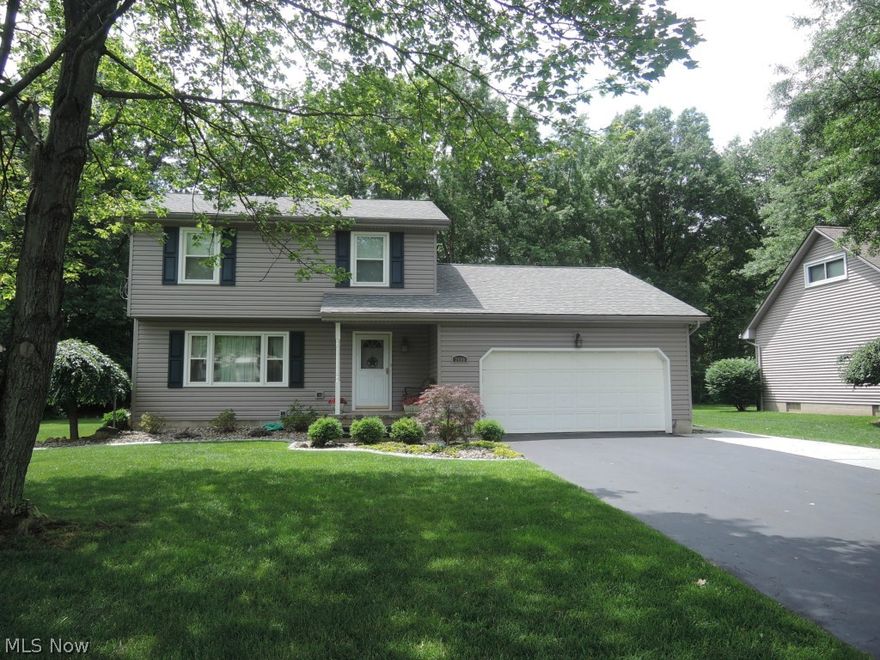 From the pristine low maintenance landscaping to the well kept, clean and modern interior, you will be impressed with this great two story home! Walking into the open foyer, you will see a neutral living room with updated carpeting (2013) and a picture window that overlooks the front yard. The formal dining was newly floored (2013) and opens to the awesome updated kitchen with new everything including dishwasher and microwave, appliances negotiable. The first floor family room is spacious with updated laminate flooring, and doors leading to the patio and backyard! 1st floor half bath gorgeously remodeled in 2012. Upstairs, the master bedroom has a large double closet with organizers! Beds 2 and 3 also are neutrally painted, and have large closets! While the upstairs landing is newly carpeted in 2013, All beds are hardwood floored! The remodeled full bath has a granite sink and new tub shower surround as well (2013)!It doesn't stop here! A full basement with a nice sized rec room has ma