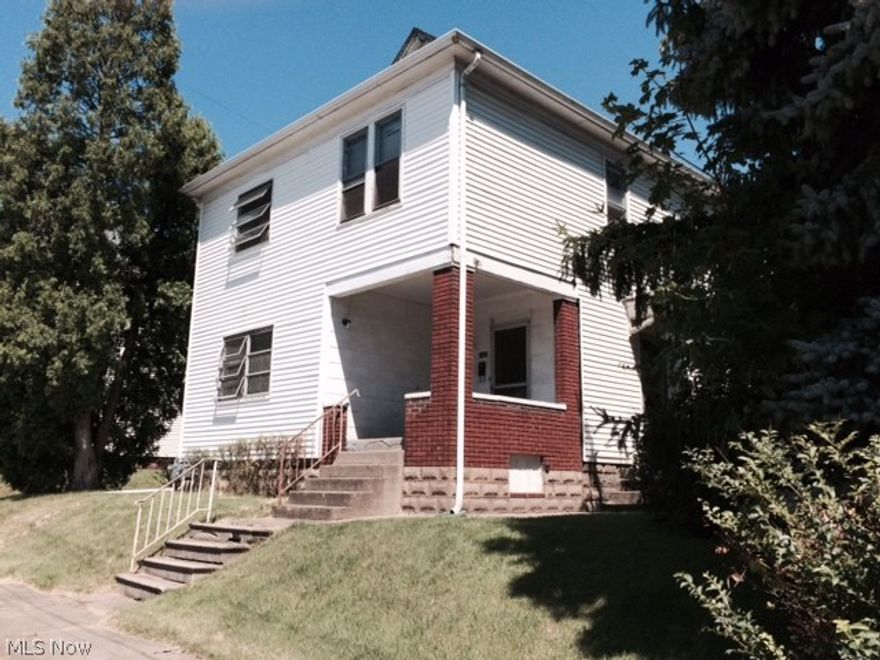 Up-down duplex with a 1 car detached garage.  Both units have their own meters for utilities.  Two separate Williamson Furnace, two separate hot water tanks.  Oak Cabinets.  Built in hutch and stained glass window.  House was rented to college students in the past. Great new price!