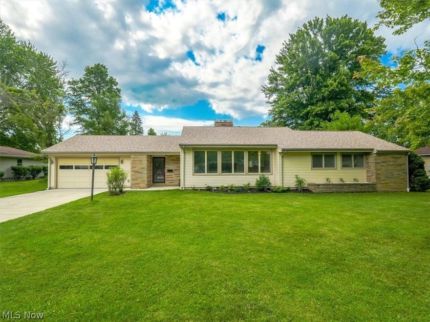 Secluded, but still close to everything! Vintage charm with updates.  Entire house has fresh paint and updated flooring. This 4-bedroom/2 bath home sits off the road on a partially wooded lot and is only 800 ft. from Lake Erie on a rare 1.5 acres (four parcels).
The property runs all the way south to Carpenter Road.  Stepping into this newly remodeled home, you are greeted by a bright, beautiful living room with large windows, built-in shelves, brick gas fireplace and original hardwood floors. The dining room is open to the living room and is connected to the remodeled kitchen. Both the kitchen and dining room have windows overlooking the 20' X 19' great room located at the back of the house, where you can enjoy seclusion and the natural beauty of the foliage and wildlife. Just imagine the garden you could create. The full basement is partially finished with new paint on the walls and floor.  Great for a man cave or rec room for the kids.  The newly added fourth bedroom could be used as an office.  New roof added in October 2023, new hot water tank 2023. Open patio in the back for your grilling and entertaining pleasure.  Located within minutes of Redbrook Boat Club, Geneva on the Lake, Historic Ashtabula Harbor, beaches, wineries and Metroparks.