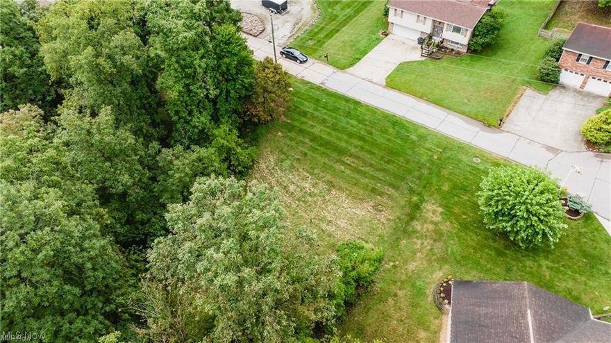 Beautiful .2066-acre building lot located in a well-maintained neighborhood with attractive homes and a peaceful setting. All utilities are available at the road including electricity, natural gas, phone, and cable, making this an excellent location to build your new home. The property is part of an HOA with annual dues of $250, which helps maintain the neighborhood including snow removal services. Please note that mobile homes are not permitted. If you are looking for a convenient homesite in a desirable community, this lot offers a great opportunity.