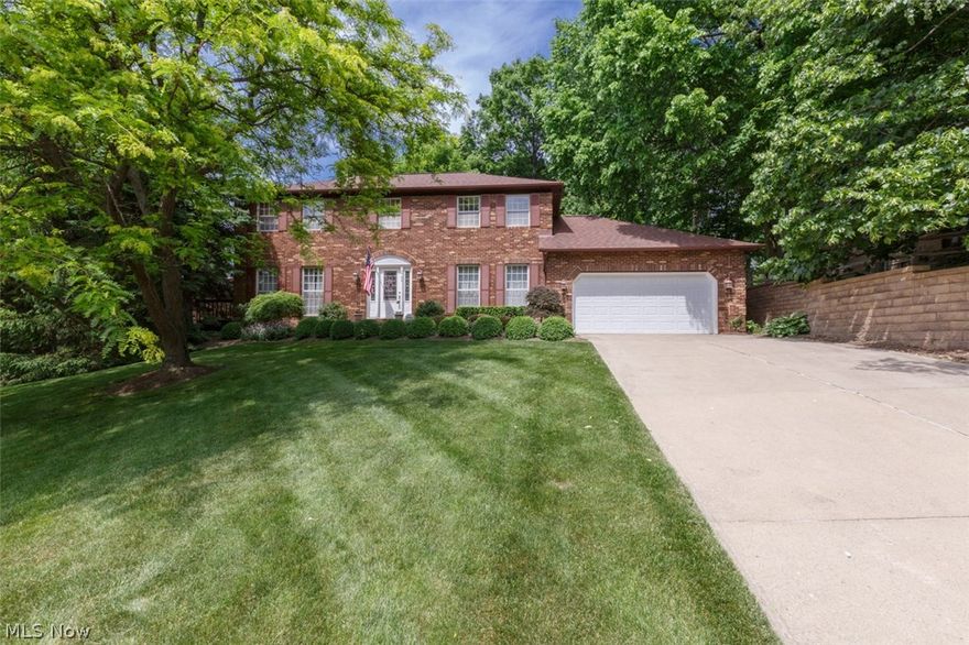 Beautiful 4 bedroom 2 1/2 bath colonial in Halle Estates. This home has been meticulously maintained inside and out. Gorgeous setting with home nestled on a hillside. Brick paver walkway leads to backyard with wrap around deck and paver patio...very private and relaxing setting. The family room features brick fireplace and door to deck. Living room and dining room. Eat in kitchen with stainless appliance package and corian countertops. Laundry area on first floor. Full basement, 2 car garage with extra storage area. This stately colonial is an absolute gem and a true must see.