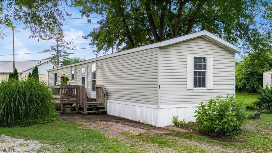 This home was built in 2005 and has 3 bedrooms and 2 full bathrooms.The home features an open concept with the kitchen and living room.The owner is leaving the stove and range. The laundry area is in the hallway for convenience with the sale including the washer and dryer. The home has a split floor plan for privacy, 2 guest bedrooms on one end and the Owner's suite on the other end. The Owner's suite features a walk in closet and a spacious bathroom. There is a front deck for relaxing. The seller is leaving a small storage shed. The lot rent is $418 per month. This includes water,sewer and trash. The owner is responsible for the mowing and landscaping. The Seller is presently using the smallest bedroom for packing.