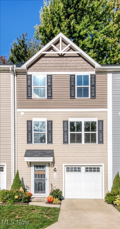 Welcome to this beautifully maintained three story townhome featuring three spacious bedrooms, two full baths, and a convenient half bath. The open concept main living level showcases beautiful wood laminate floors and a seamless flow between the living room and kitchen area, perfect for everyday living and entertaining. The inviting eat in kitchen includes a center island and comes fully equipped with all appliances, including the washer and dryer. Enjoy your private deck for outdoor relaxation and the conveniences of an attached one car garage. Thoughtful updates include new ceiling fans, stylish new light fixtures, and gutter guards on all gutters for easy maintenance. This move in ready home offers modern comfort, functionality, and charm throughout.