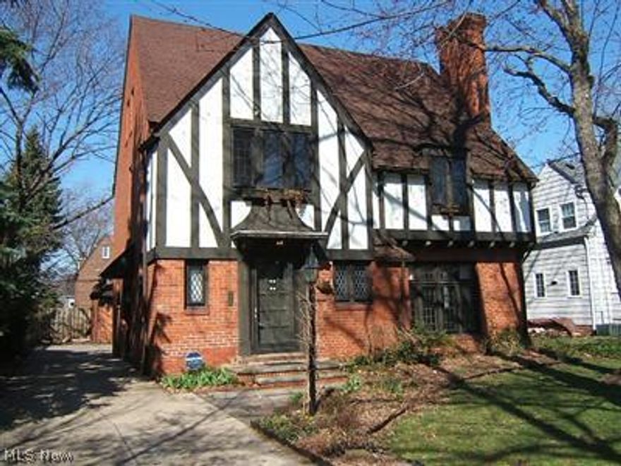 Beautifully appointed Fernway Tudor. Architectural details include stunning leaded windows, wood floors, curved staircase and a reading nook. Master bedroom has huge walk in closet, balcony and attached glamour bath. Private stone patio and nice backyard. Lower level includes ceramic tiled rec room with bar and fireplace, tiled office/study with built ins and a spacious tiled laundry room with cabinetry. Walk to Shaker Lakes and schools. Great commute to hospitals, universities, downtown and University Circle, Cleveland's Cultural Hub!