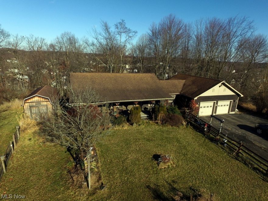 Nestled in the heart of East Palestine, Ohio, this picturesque property offers a serene retreat with a modern rustic charm. Boasting 3 cozy bedrooms and 3 well-appointed bathrooms, this home merges comfort with convenience, perfect for family living. Step inside to find a spacious living room that invites warmth with its wood-clad walls and homely decor, seamlessly leading to a dining area that echoes family gatherings and shared meals. Each bedroom offers a tranquil escape with ample natural light, ensuring restful nights and energized mornings. There is a full basement with cement block foundation.  There is an attached 2 car garage and nice winding blacktop driveway. The home is perched on a hill and is semi secluded with a great front porch view over rolling county side. This is a good one owner home with shingle roof, natural gas heat and hot water along with a 200 amp service.