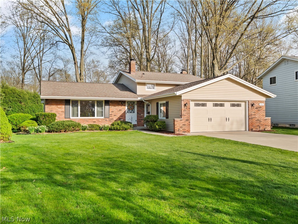 Don’t miss this rare split-level with 3 finished floors and a full unfinished basement. This immaculately maintained 3 bedroom, 1.5 bathroom home has been well-cared for and offers endless possibilities. From the foyer is a living room brightened by a large picture window. The vaulted ceiling travels from the living area to the formal dining room. The kitchen centers the main floor and features a pantry and a dinette area for more informal dining. Step down to the casual family room that has a sliding glass door leading to the private patio. Back inside warm up by the cozy wood burning fireplace or have some quiet time in the office/flex room. A convenient ½ bathroom completes this level. Upstairs, the primary bedroom is conveniently connected to the main bathroom. Additional bedrooms have wood flooring and good closet space. Downstairs, the full unfinished basement adds plenty of space for storage, workout station and recreation area with the durability of Nature Stone flooring. Outsi