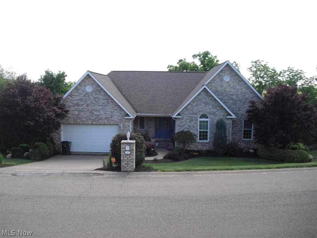 The nicest house in St. Clairsville can now be yours! Ranch home with extensive upgrades including custom kitchen with granite and stainless appliances and great room with cathedral ceilings and architectural arches. Finished basement includes bar area and a home office. Beautiful landscaping and multi-tier deck and patio overlook fenced back yard area. An entire level of the home has been dedicated to a storage area.