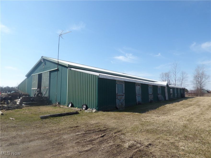 Approximately 14.8 acres parcel Currently used for agriculture.  Zoned General Business.   Has approximately 60 ft. x 120 ft outbuilding with one half concrete floor. Approximately 12 ft. wide extensions along both side of outbuilding, making a total of Twenty 12x12 stalls.  Electric to building and plumbing with living quarters in building.  Septic system replaced around 2012.  Small pond with fish on property, needs cleared of cattails, etc.   Owner states possibly gas and spring on property but none have been drilled.  Taxes reflect CAUV valuation.  Owner says MAKE AN OFFER