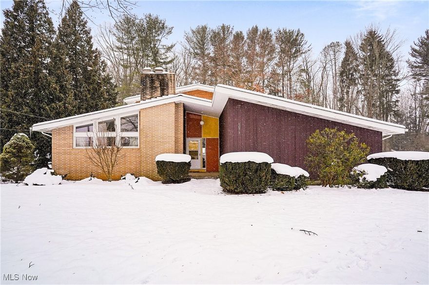 Here's a Kent, Ohio Mid-Century Modern BEAUTY you won't want to miss!! This wonderfully-constructed and cared-for FIVE bedroom, built and maintained by Original Owner, is going to steal your heart (but not your wallet)! This cedar-clad almost-2000 sq. ft. BEAUTY comes with an exterior bonus that makes it THE FIND of 2025-- a nearly half-acre Vacant Lot with road frontage, allowing for a potential build in the future. All told, there's nearly an acre that sits adjacent to a beautiful woods just outside Kent's city limits yet close to KSU, trails, shopping, restaurants and major highways! Inside, you'll be pleased with the features of the home: *A generously-appointed, vaulted living room with a burning fireplace *4-Season Room with wood burning stove *original mid-century style cabinets in kitchen and both baths *hardwood in all 5 bedrooms, living room, dining room *open concept design *period lighting *basement family room *washer/dryer & freezer included *Water Filter system. Buyers' personal preferences and sweat equity will come to bear on this property, but the charm here will win you over and make your every effort worthwhile!! Escape Cabin Fever and take advantage of this amazing opportunity today! We are here to answer your Questions, so don't hesitate to reach out or consult with your trusted buyer representative!