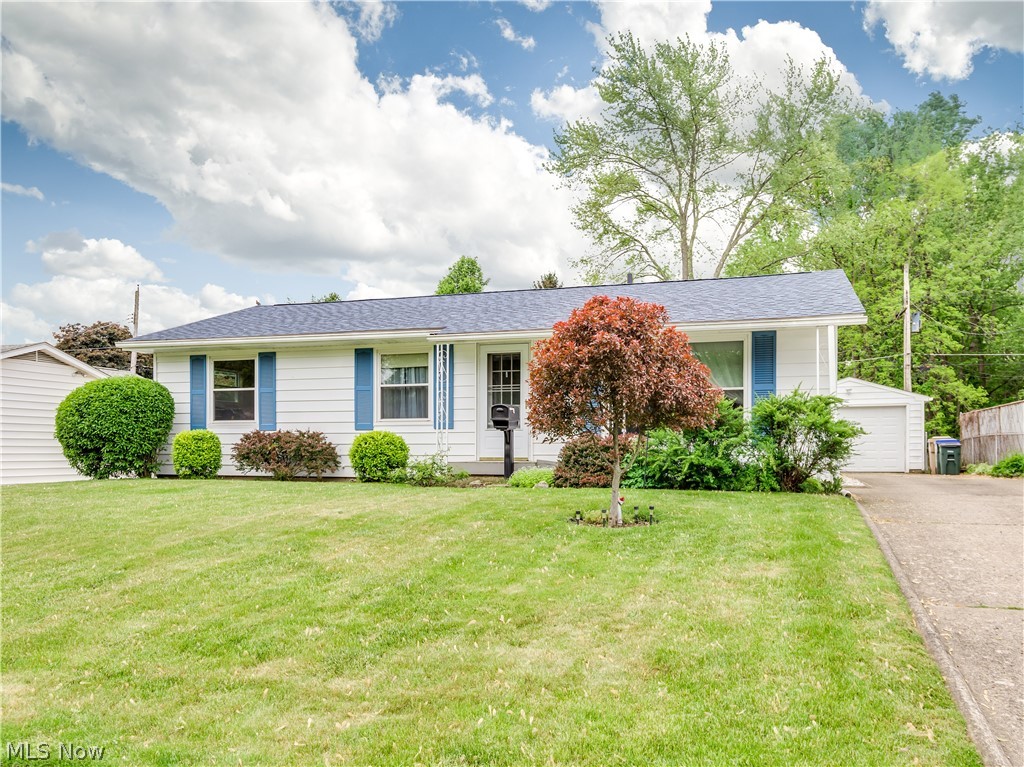 This well-kept ranch is a must see! Beautiful large windows in the living room gives the space plenty of natural light. There is an eat-in-kitchen and a half bath off of the kitchen and into the first bedroom. As you move through the home there is wood flooring throughout and a full bathroom off the living room. The second and third bedroom are at the front of the home. This home offers a rarely found basement (in this neighborhood) that is partially finished and offers work and laundry space. The screened in back porch offers a great place to spend spring and summer days that look into the beautiful backyard including views of a creek. Updates include: Roof (2017), Water Heater (2019), Garage Door (2015), Trane XR80 Heating (2014), Ext house painted (2014), Garbage Disposal (2019).