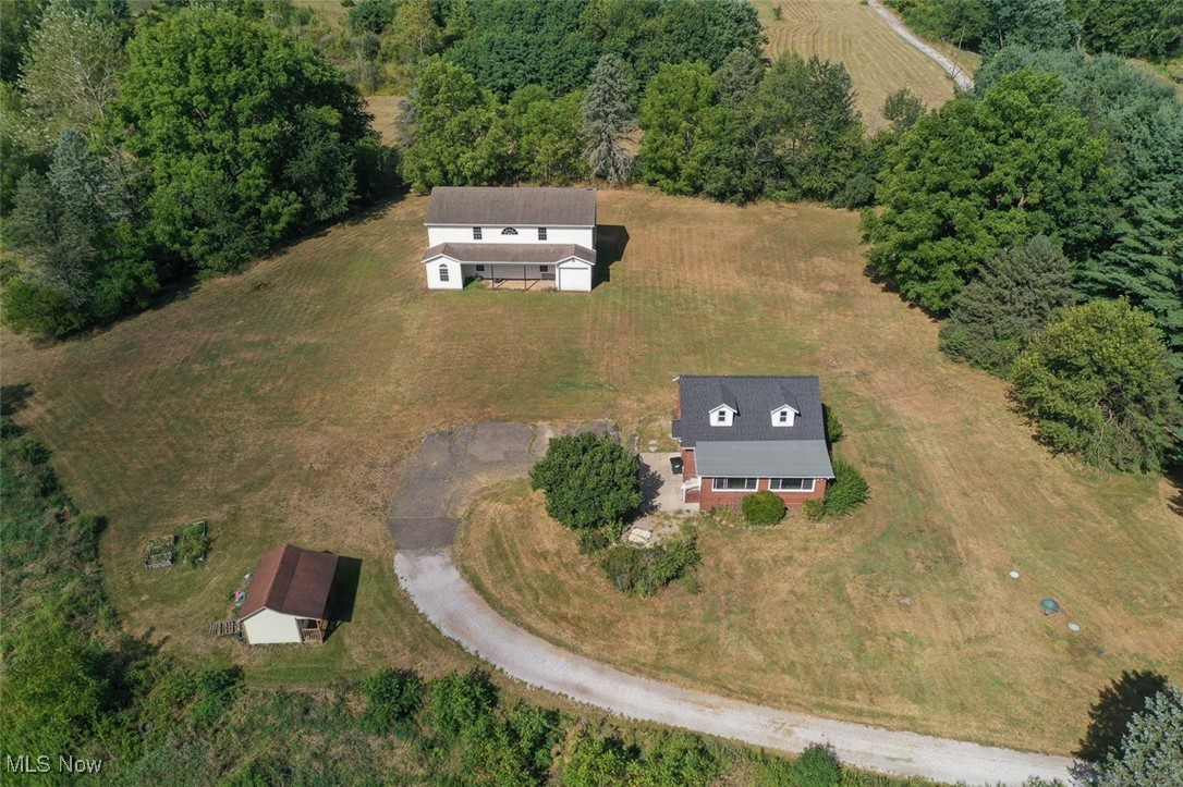 Estate Auction. 121+ Acres, 2 Hideaway Farmsteads Offered In 4 Parcels,
Remodeled Bungalow Home & Large Pole Barn. Handyman Farmhouse with Rough Barn, Vacant Land Parcels, Marketable Timber. Osnaburg Twp., Stark Co., OH, Osnaburg Local Schools. Live Auction with Online Bidding Available.
All sells to settle the Donna Jean Middaugh Estate, Stark Co. probate #252544, on location. ONLINE BIDDING BEGINS TUESDAY, SEPTEMBER 16, 2025, at 12:30 PM, and AUCTION LIVE ON-SITE BIDDING WILL BEGIN FRIDAY, SEPTEMBER 19, 2025, at 12:30 PM. Longtime ownership, gently rolling land parcels with tillable acreage, a gas well, and all mineral rights owned by the estate are included. Marketable timber in back, ample frontage along Broadway Ave. Present crops reserved by the tenant farmer. #4: 2386 Broadway Ave. Approx. 46.5 acres of wooded and recreational land with a long private driveway. Stark Co. parcel #3704913. Improvements include a solid brick bungalow home built in 1945 with 1,217 sq. ft. Recently remodeled home with updated roof, windows, furnace, A/C, wiring, kitchen & interior. Updated septic. 3 bedrooms, 2 full baths, oak kitchen, large living room. Full basement. Outbuildings include a 30’x50’ two-story vinyl-sided pole barn/barndominium. Unfinished interior. Children’s play shed included. Taxes are $962.76 per half-year. For Parcels 1-3, see MLS #5153244.