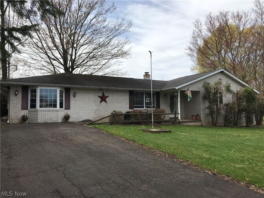 Welcome Home to this 4 bedroom 4 bath brick ranch sitting on 2.69 acres.  Beautiful new bamboo flooring throughout the living room, hall and kitchen.  Plenty of cabinets in this remodeled eat in kitchen with cherry cabinets, granite countertop, pull out drawers and new stainless appliances. First floor features roomy living room, Full bath, bedrooms with double closets, bedroom with en suite and master bedroom with master bath and walk in closet.  finished basement has game room with indoor charcoal grill, family room with bar and wood burning fireplace plus a bonus room and 3/4 bath.  Enjoy the outdoors with this L-shaped in ground pool with sturdy pool cover, patio, fenced in area with vinyl for privacy and chain linked. New heat pump and centra air. Roof approximately 10 years old.  Two car detached garage with electric.  Home has been freshly painted and ready for you to move in.