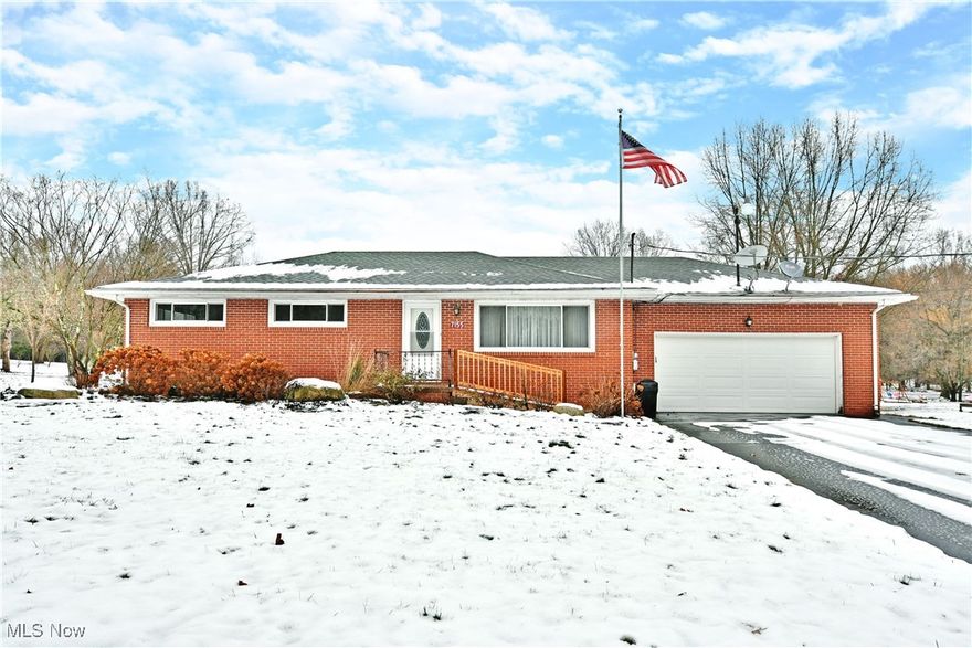 Deck your own halls with style this year; watching the snow fall from the comfort of your living room within this must-see Burghill home! Checking all the right boxes, the all-brick ranch is an instant crowd favorite, upping the ante with its partially finished basement and plenty of scenic land. Take advantage of its move-in-ready condition to be through the front door as soon as possible, allowing you to explore and personalize its desirable, three-bedroom layout. Taking you from the durable, red-brick exterior to a spacious living room dressed in warm, hardwood styled flooring and lined with matching trim; a theme that continues throughout the home. A large entertainment center is found at the far wall, while an adjacent central dining space brings its own casement offerings. Tiled flooring spills into the kitchen where polished, stone countertops run beneath a tiled backsplash.  Opposite the dining room, a pass through half bath mirrors the styling cues before leading into the carpeted master bedroom. Two additional bedrooms branch from the main hall, the small offering hidden first floor laundry provisions. A tastefully appointed full bath wows with its glass door shower, completing the floor. Down at the basement level, the expansive, wood panel lined rec room highlights a curved brick bar for easy entertaining. Utilities and storage join a full lower bath to round things out. Let's not forget about the 2 car heated garage. Don't miss out on this beautiful home.