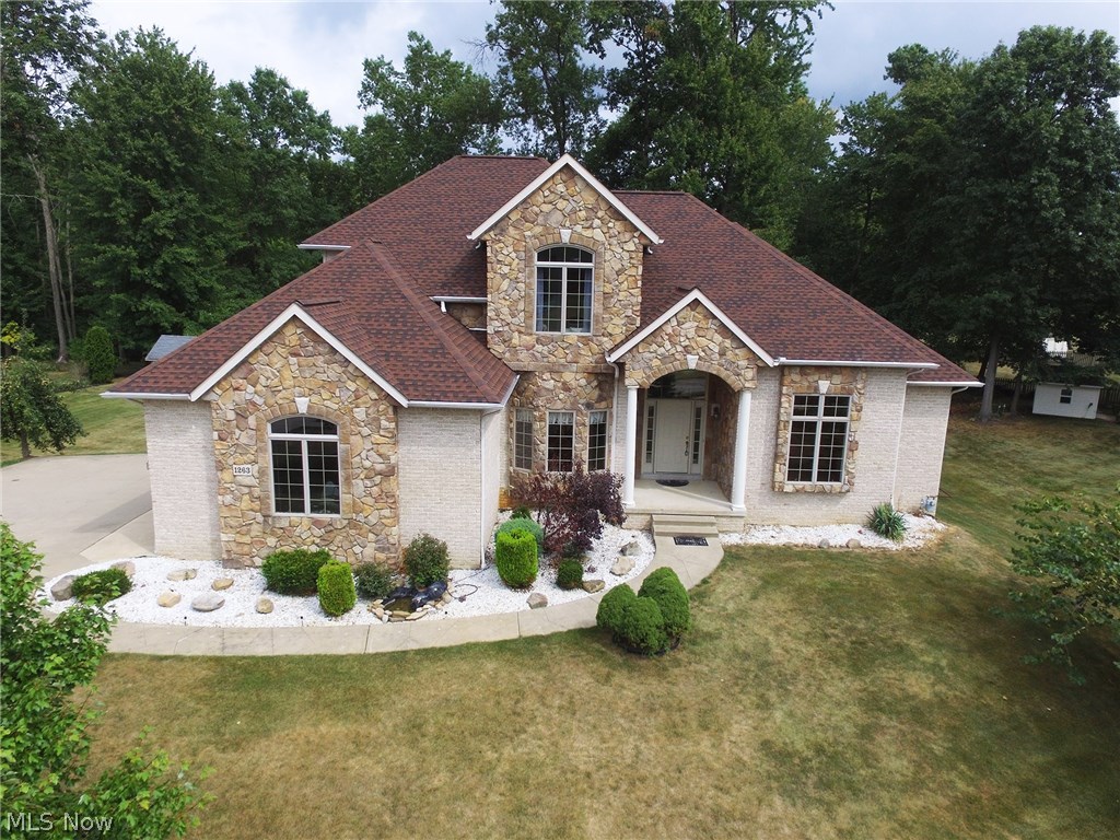 Welcome to this breathtaking contemporary custom-built home located in desirable Chenoweth Estates. This home boasts over 4,100 square feet. There is a fabulous two-story great room with a white brick fireplace, sun room with built-in bar area and skylights that opens to a vinyl deck leading to a luxurious hot tub. The kitchen is a chef's dream. There is solid maple cabinetry, granite countertops, and gleaming hardwood flooring. There is a first floor master suite with trayed ceilings and a bay window. The master bath has an oversized jacuzzi tub, double bowl sinks, and a separate shower. The second floor has three large bedrooms, a full bath, and a bonus room. The lower level is the quintessential in-law suite. There is a second kitchen, living area, and an additional three rooms that can be used however you wish. All of this plus a side-load three car garage. Stop looking! This home has it all. Call to schedule a showing today!