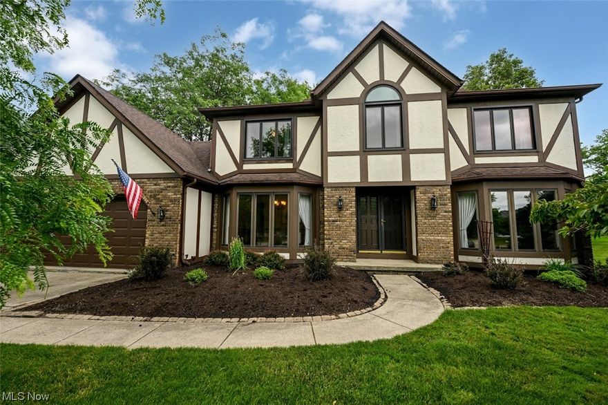 Wow! This Classic Tudor is tucked away on a serene cul-de-sac lot in the most desirable Royal Valley Development! A large foyer entry opens to a Dining Room to the left and Living Room (or Office) to the right...each with a wall of tall windows and natural light. A set of french doors lead to the Family Room with a pretty beamed ceiling and gas fireplace. The Family Room is wide open to the kitchen with 2 sets of sliders leading to the gorgeous park-like yard and paver patio. The spacious eat-in Kitchen has rich wood cabinetry, granite countertops, and stainless appliances. A convenient Laundry Room and 1/2 Bath complete the 1st Floor. Upstairs you will find a large Owner's Suite with a vaulted ceiling, walk-in closet and remodeled bath. Three additional bedrooms & remodeled main bath complete the 2nd Floor. The finished lower level includes a huge Rec Room, 3rd full bath and plenty of storage. MAJOR updates include new windows (2016), new furnace and central air (2020), new hot water